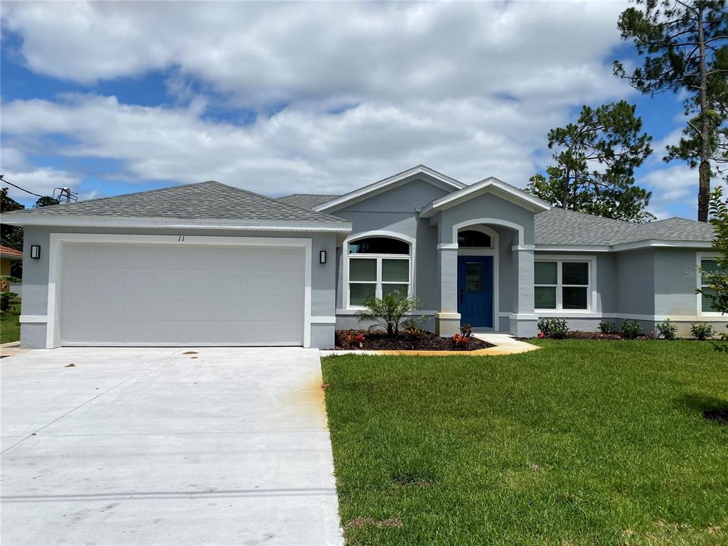 front view of a house with a yard