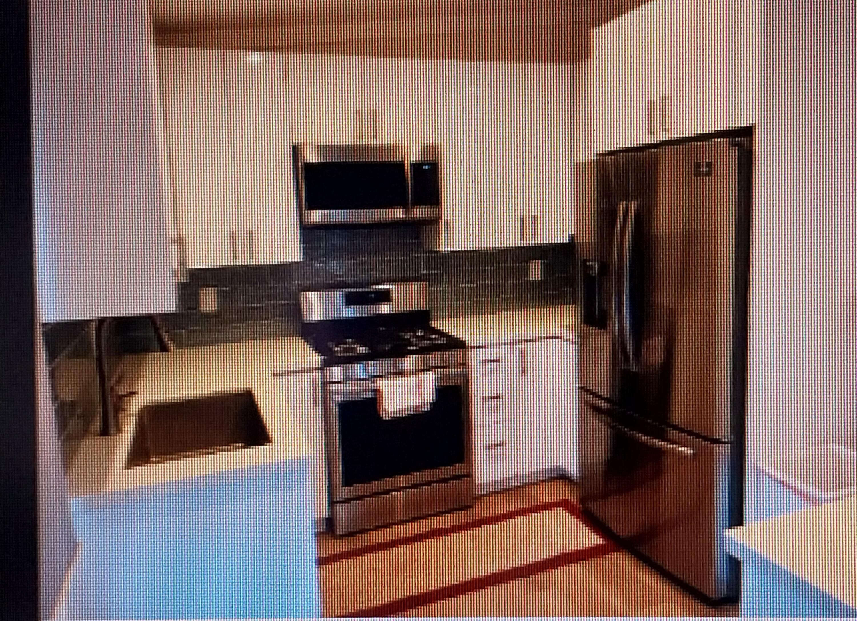 a kitchen with a refrigerator stove and microwave