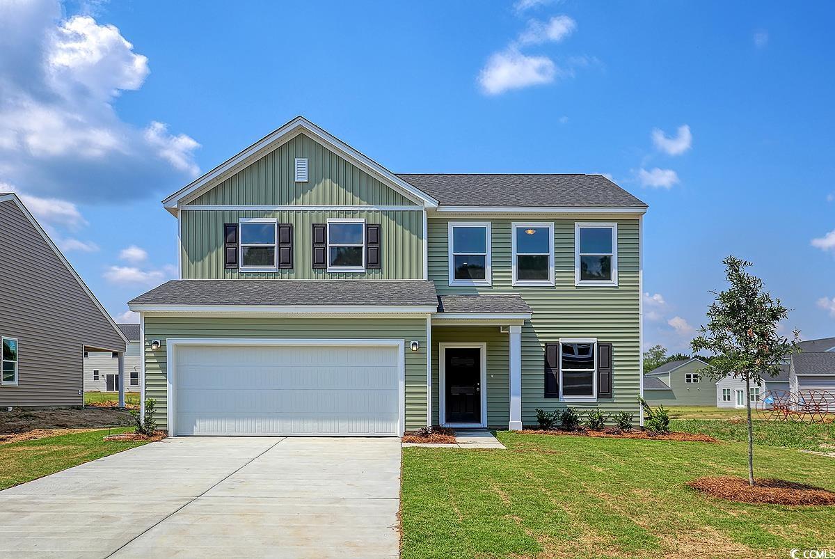 View of front of property with a front yard and a