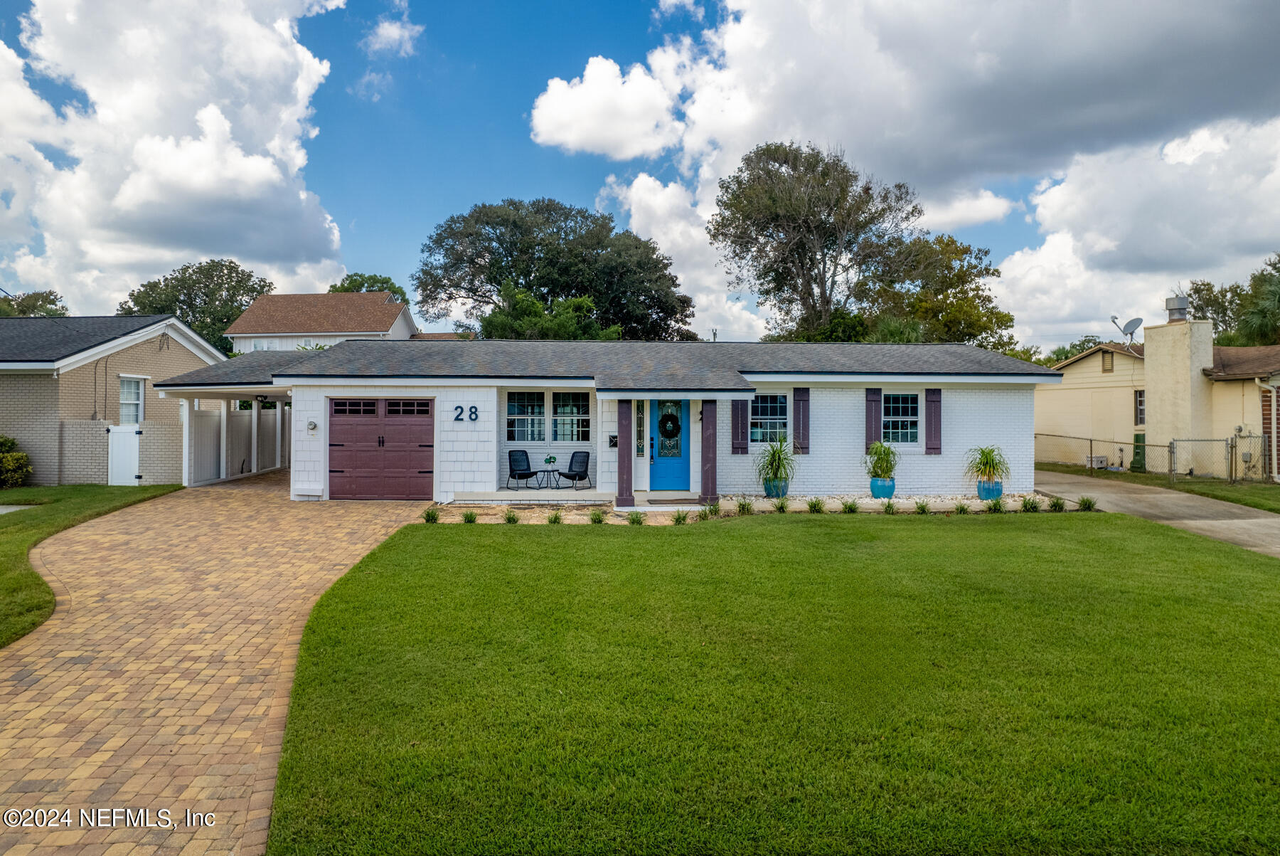 a front view of house with yard and green space