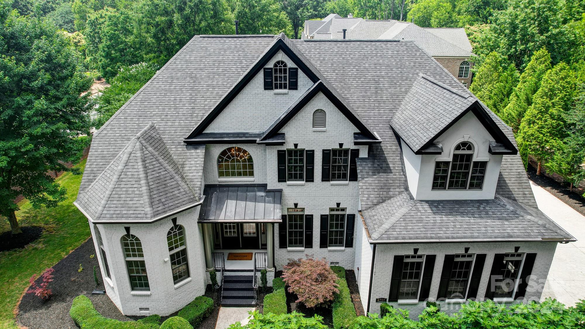 a aerial view of a house yard and deck