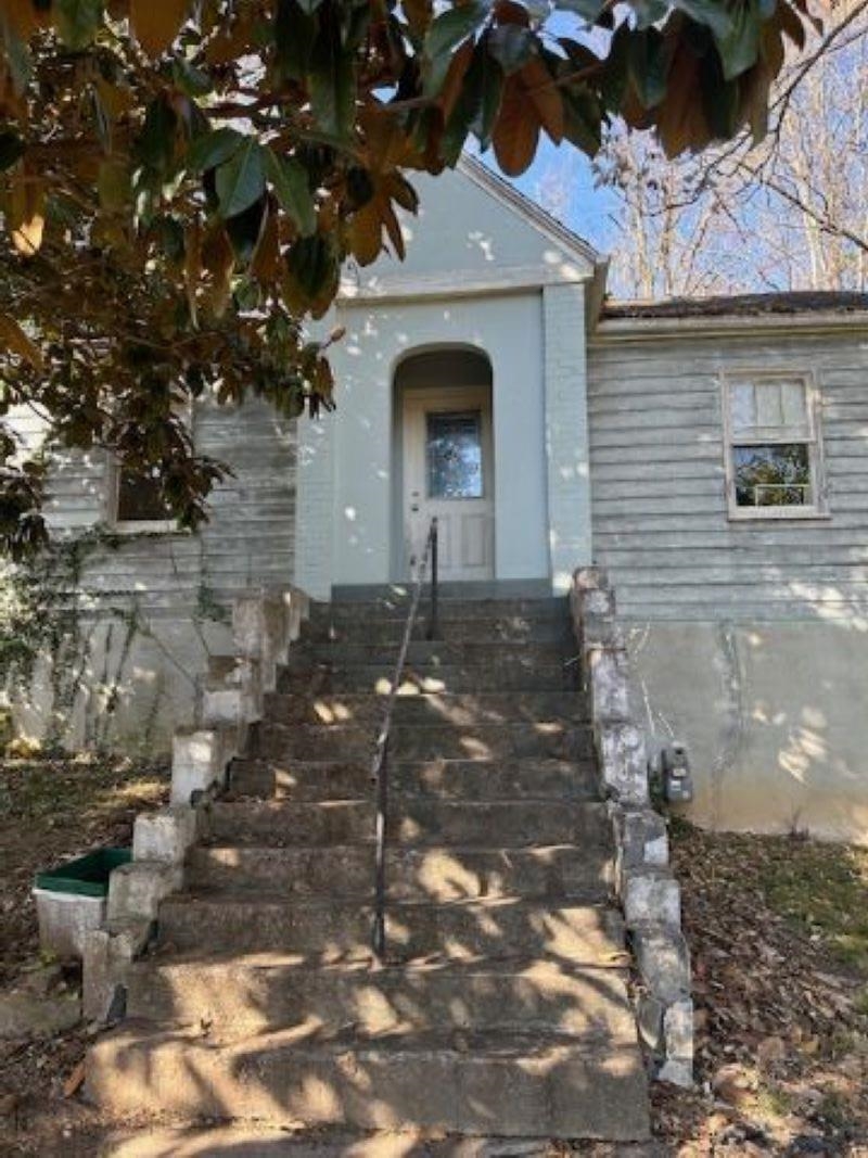 a front view of a house with parking area