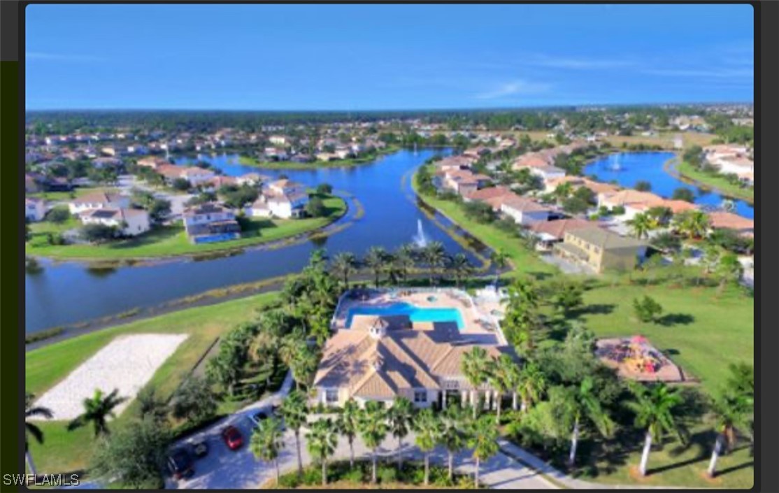 an aerial view of a residential houses with outdoor space and swimming pool