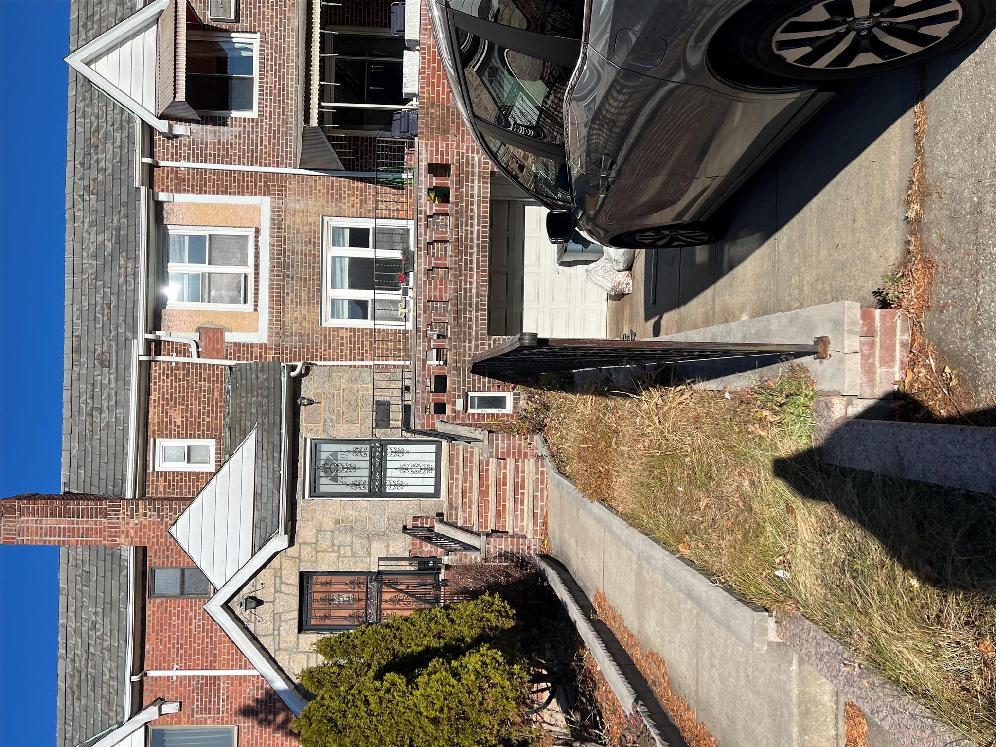 View of property featuring a garage