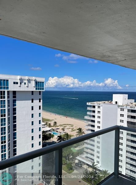 a view of a balcony with an outdoor space