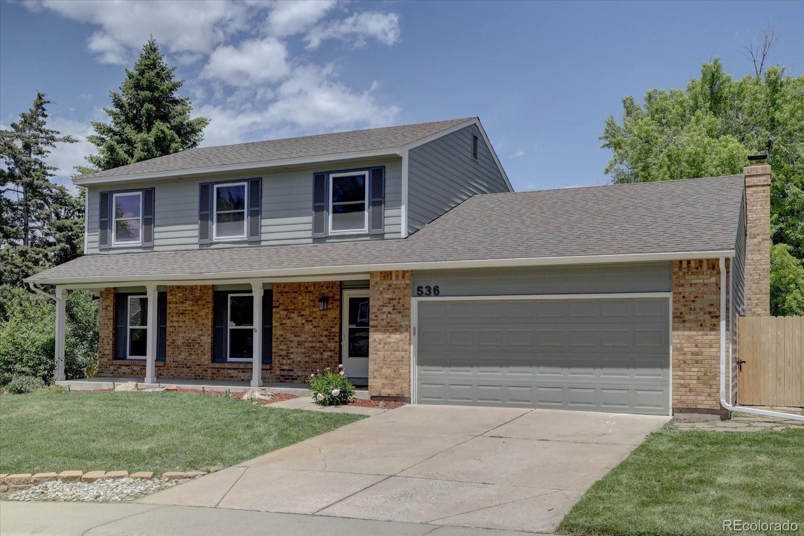 a view of a yard in front of a house