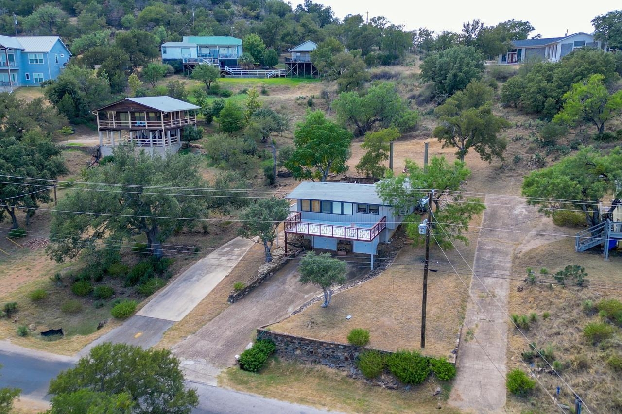 an aerial view of a house with a garden