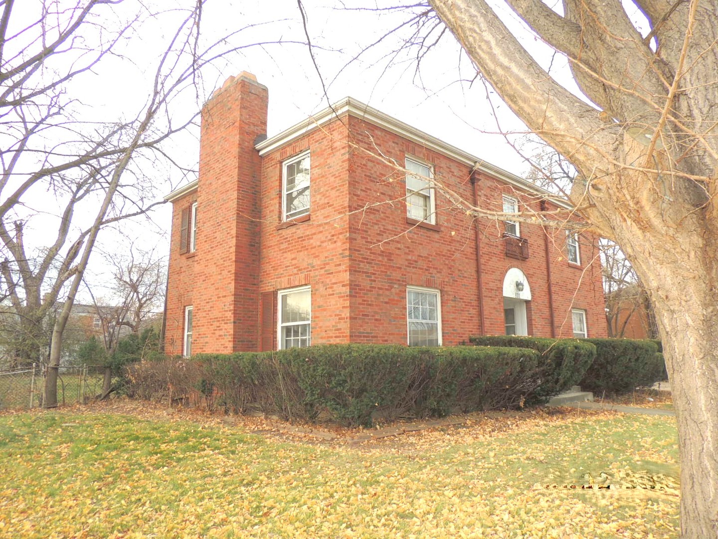 a view of a large building with a yard