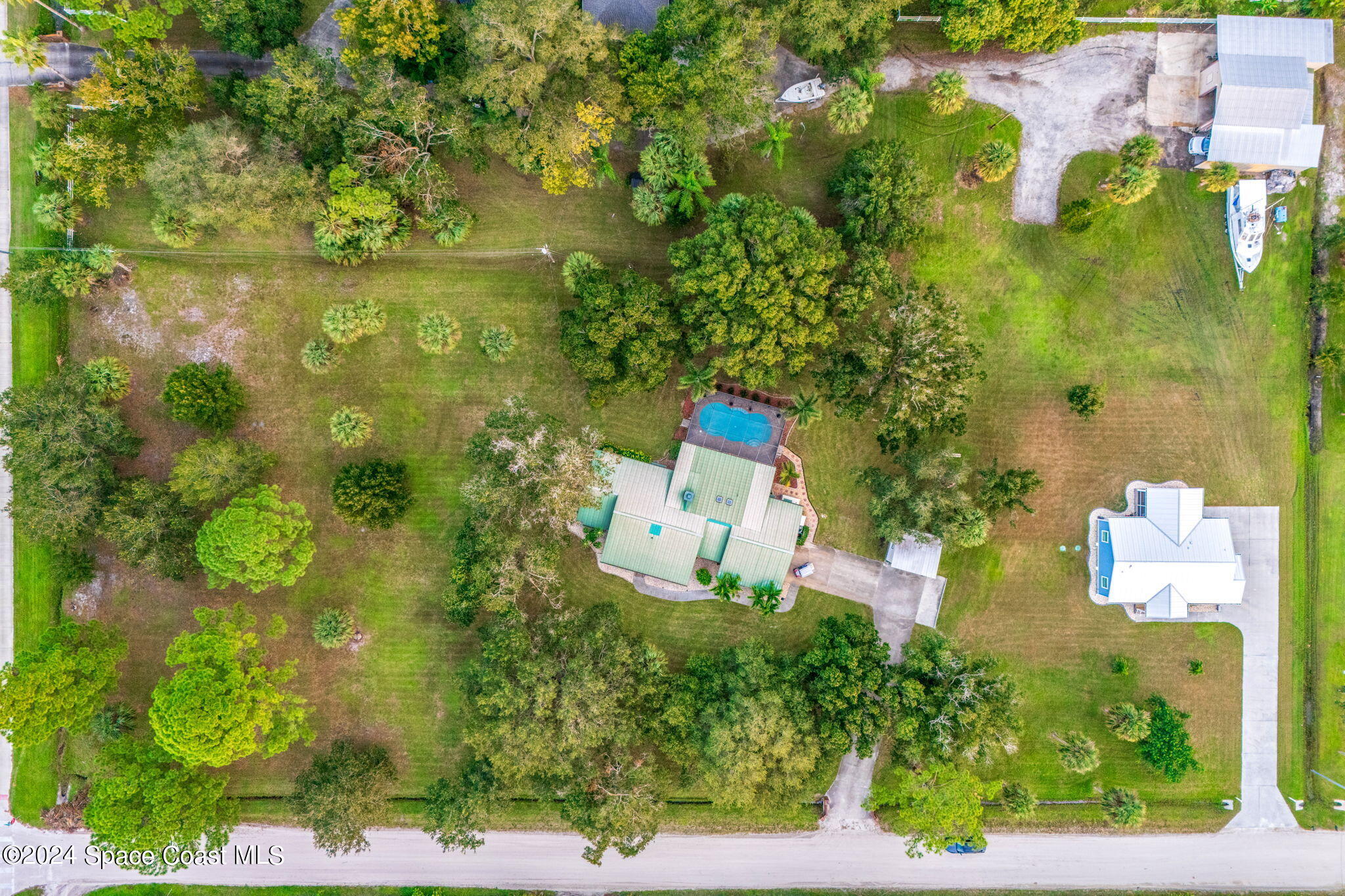 an aerial view of residential house with an outdoor space