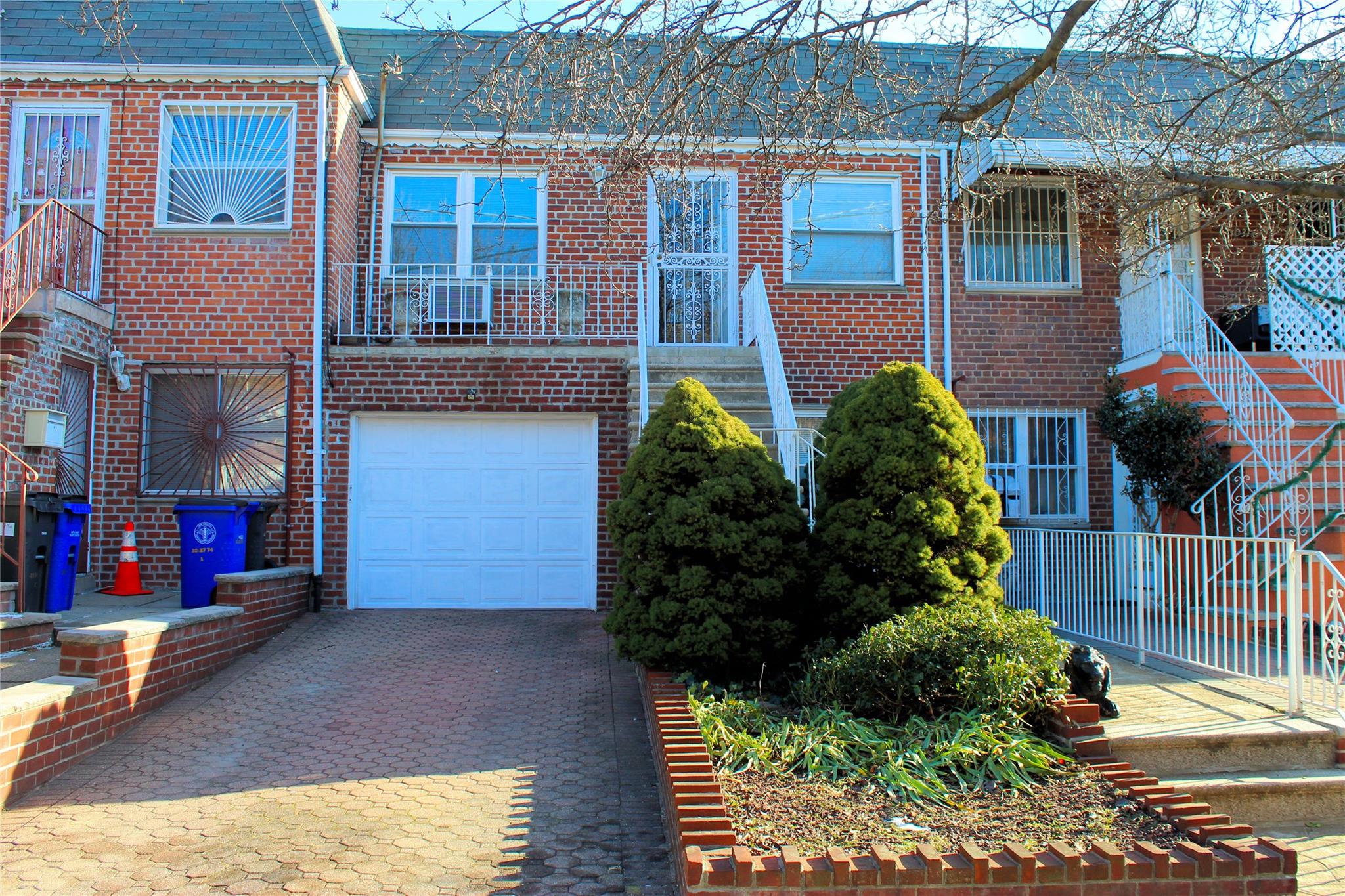 View of property featuring a garage