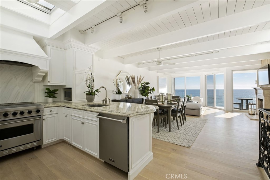 a kitchen with stove and cabinets