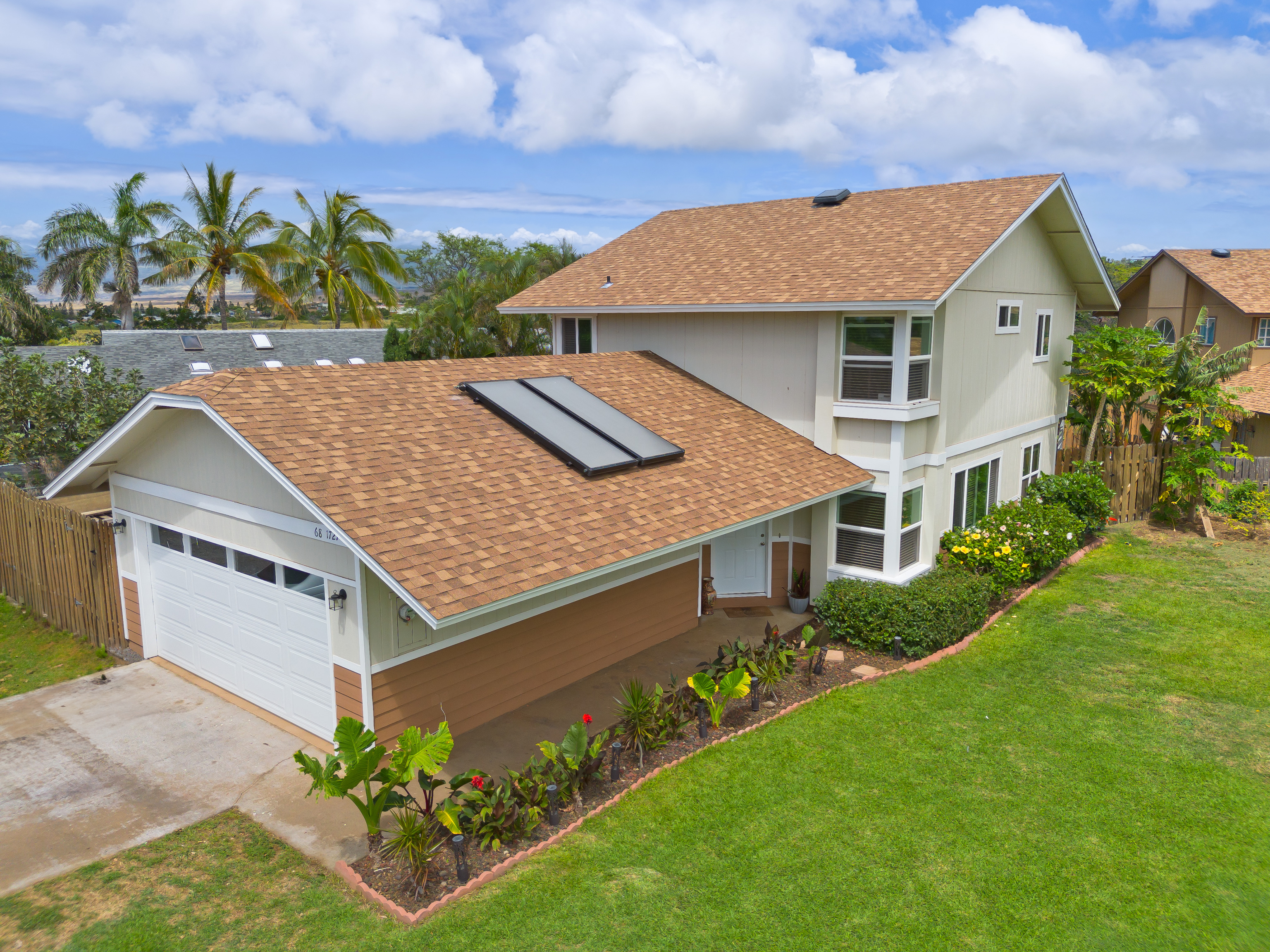 a aerial view of a house with a yard