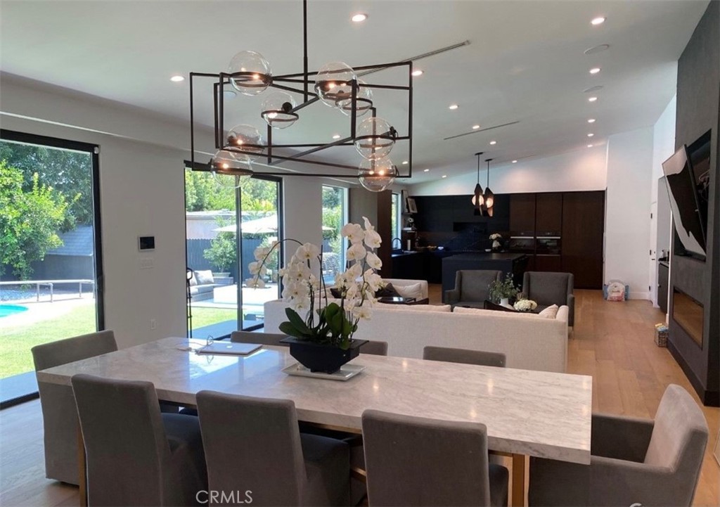 a kitchen with a table and chairs in it