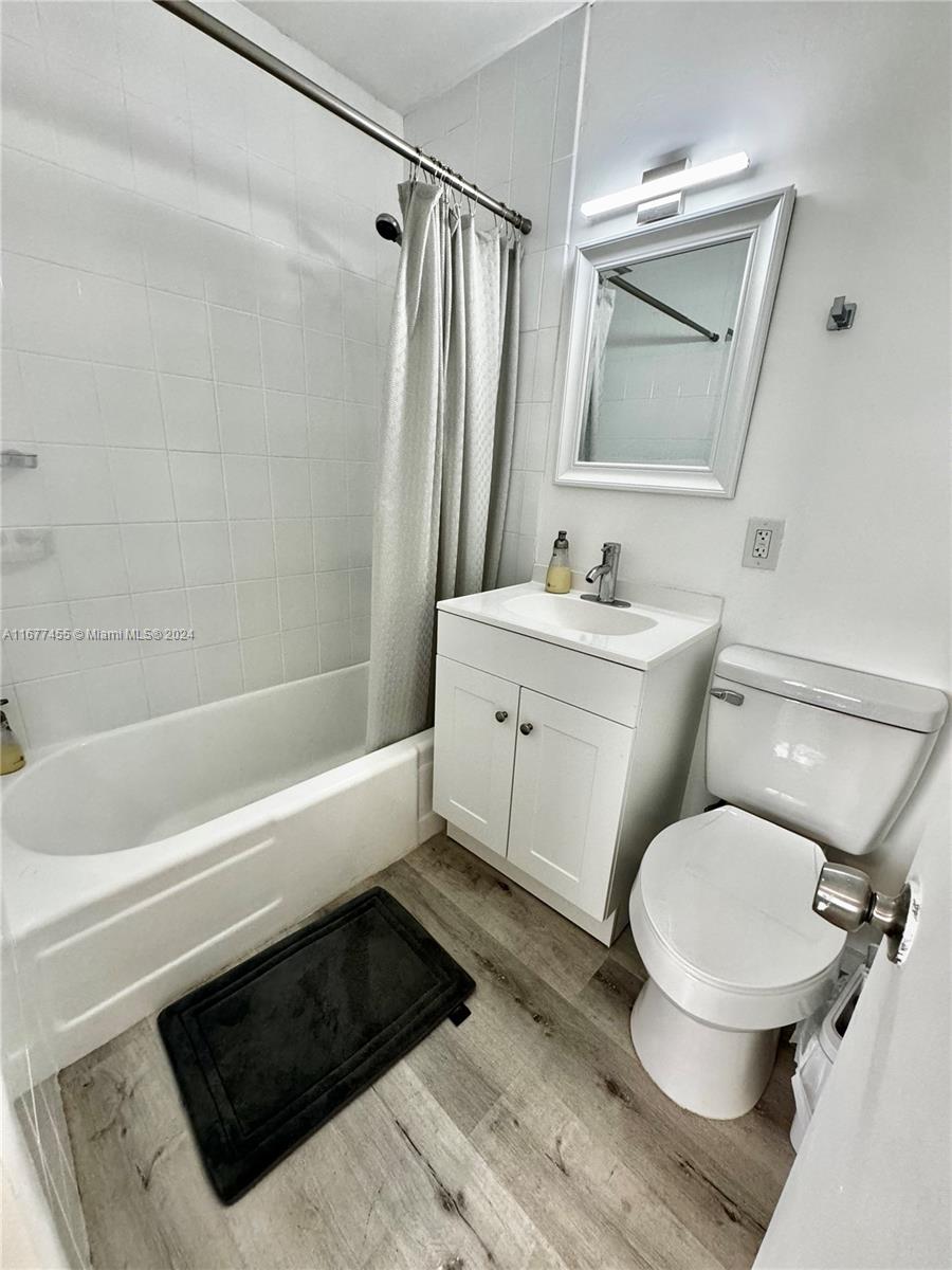 a bathroom with a toilet a sink and a bathtub