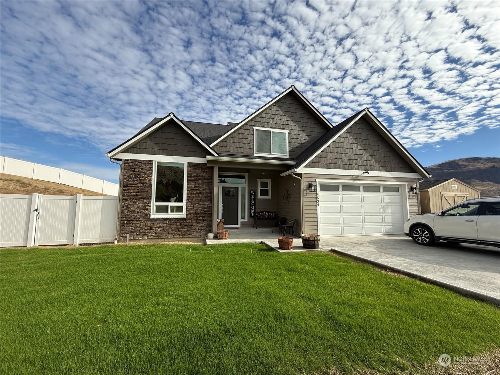 a front view of a house with a yard