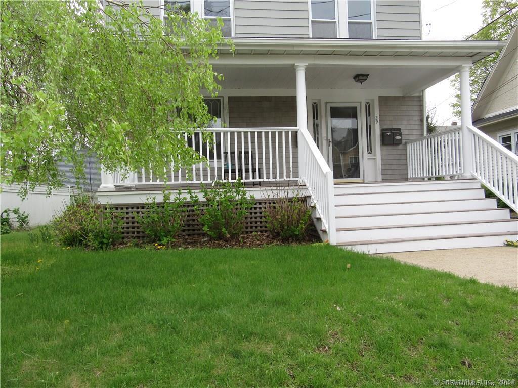 a view of a house with a yard and plants