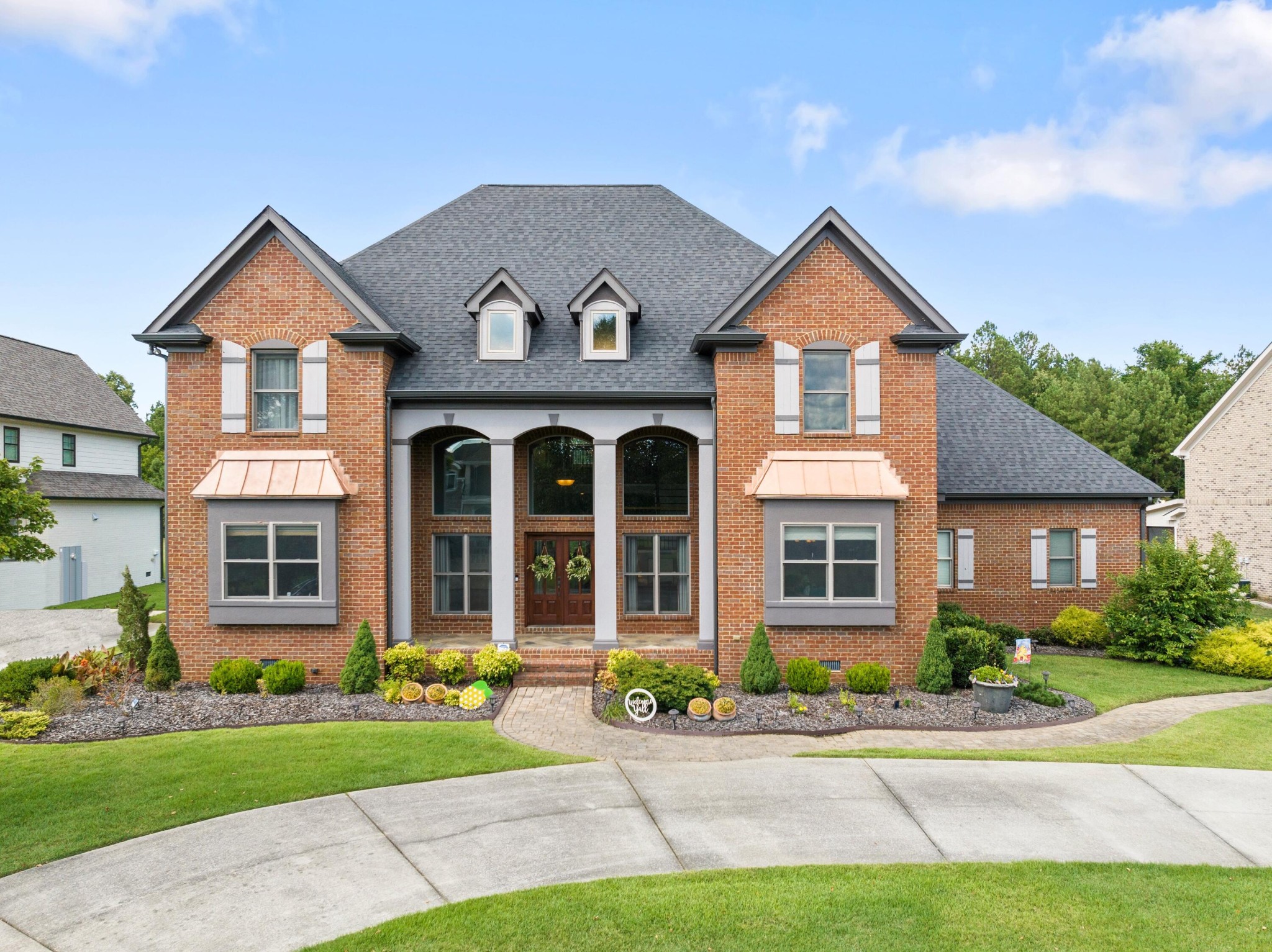 a front view of a house with a yard