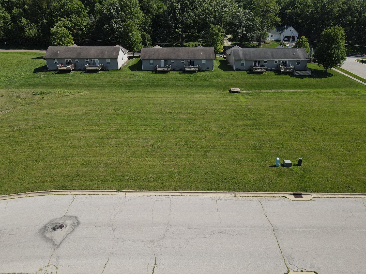 a view of a field of grass and more windows