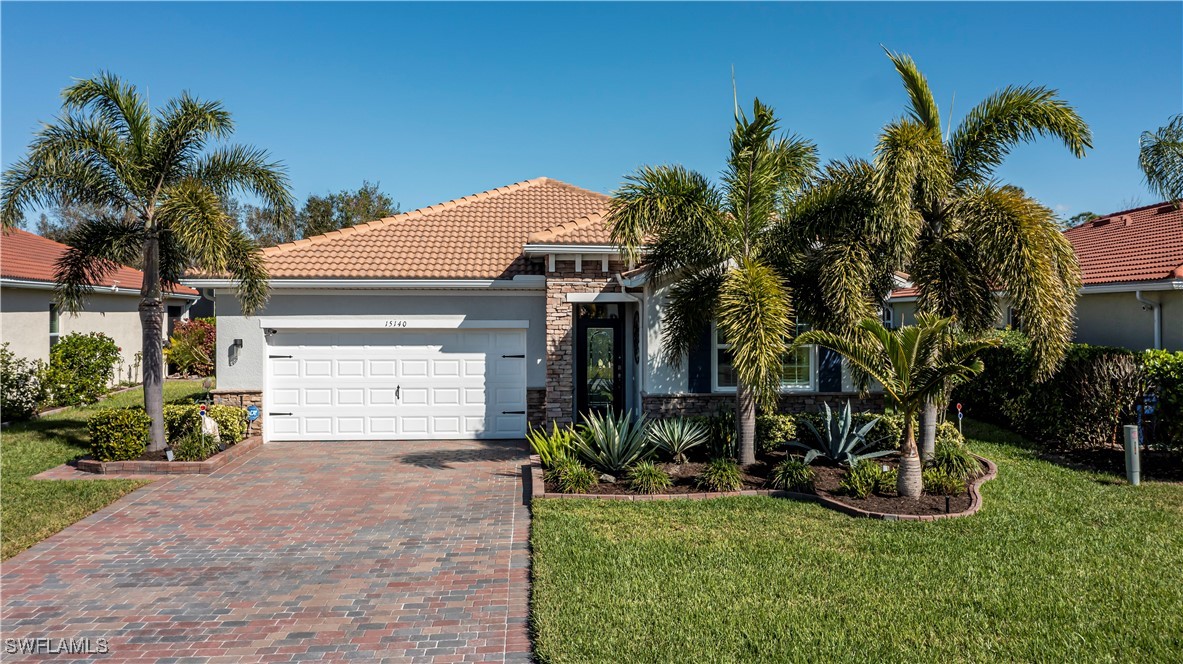 a view of house with yard and entertaining space