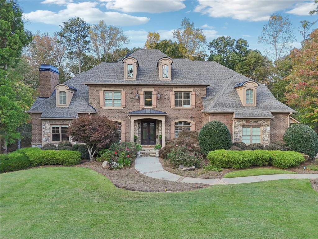 a front view of a house with a yard