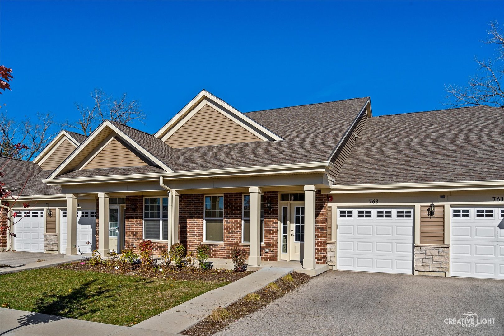 front view of a house with a yard