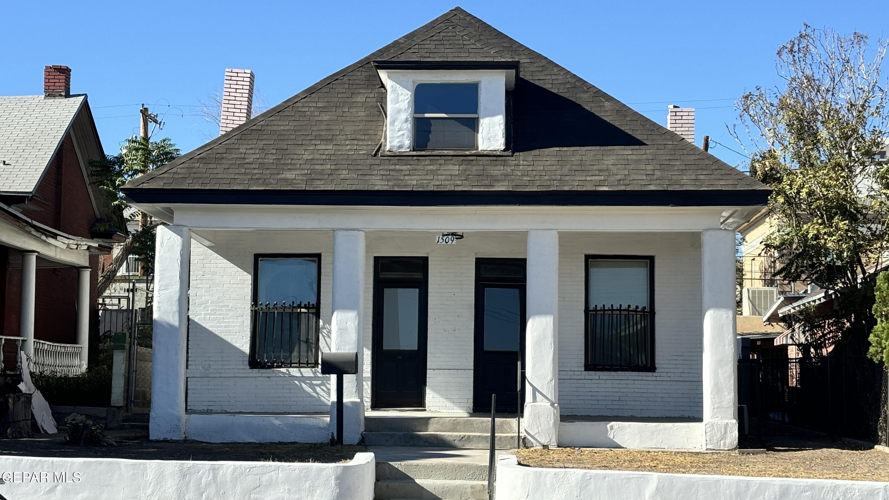 a front view of a house with parking