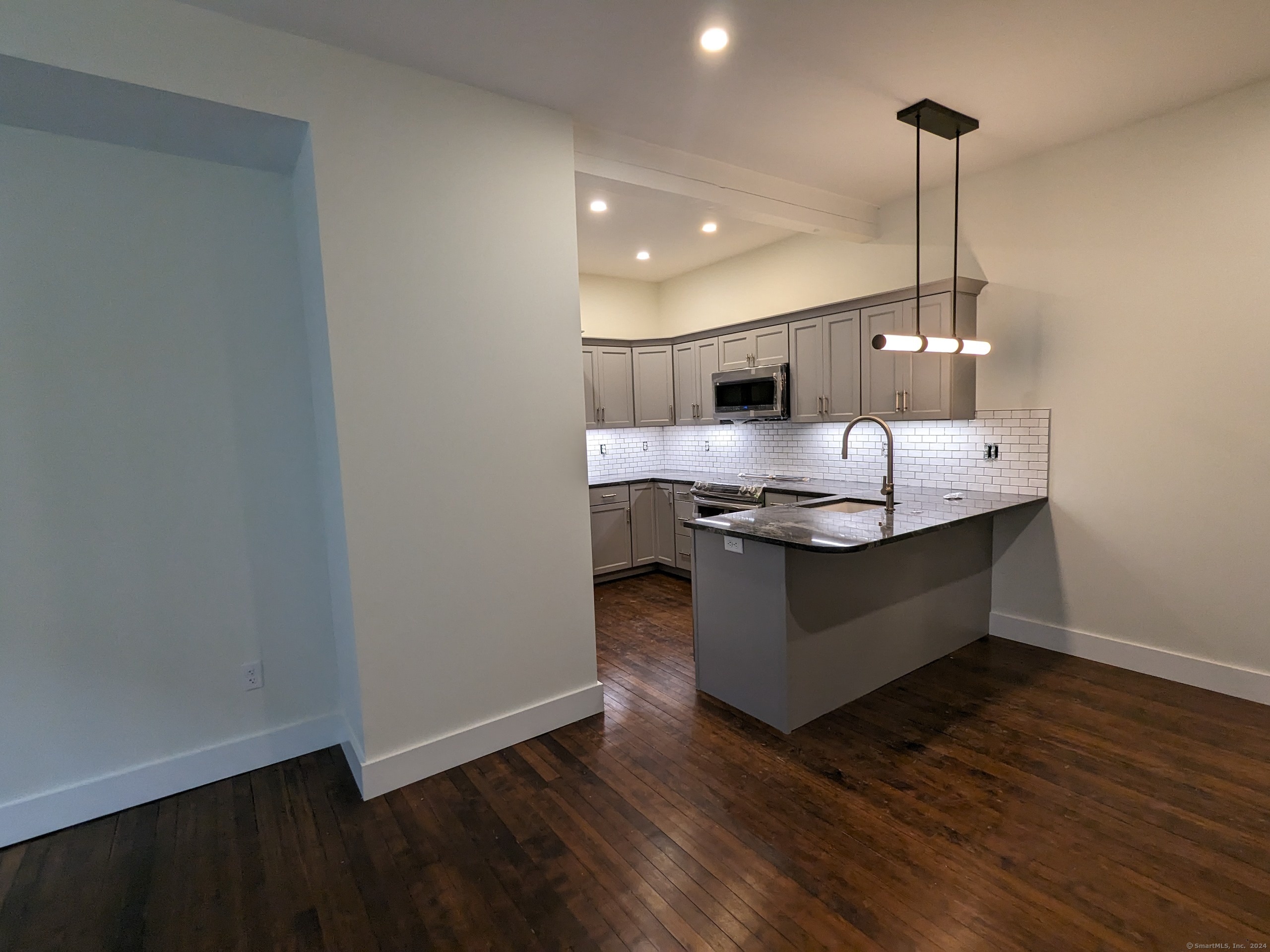 a dining hall with wooden floor