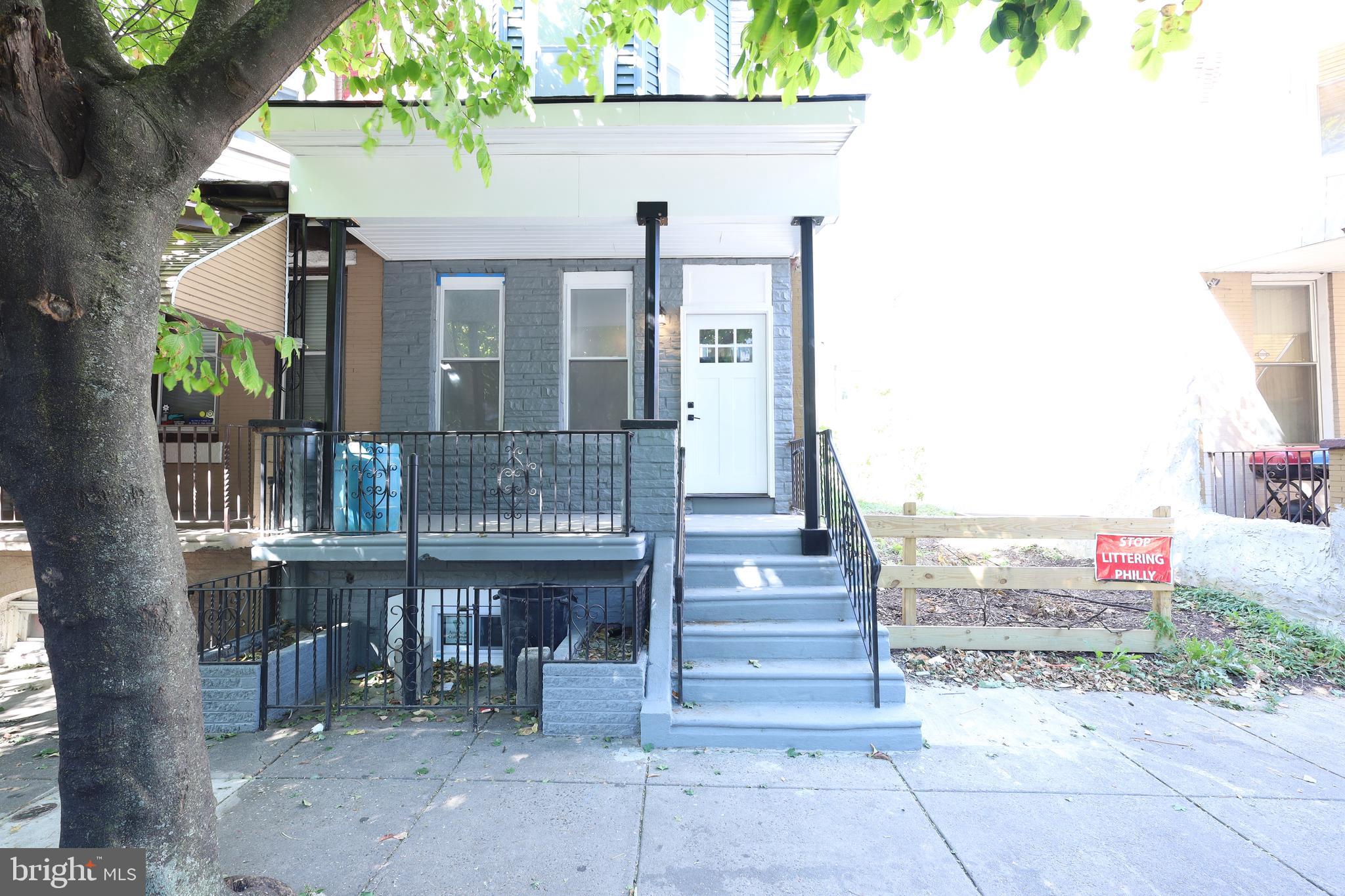 a front view of a house with chairs