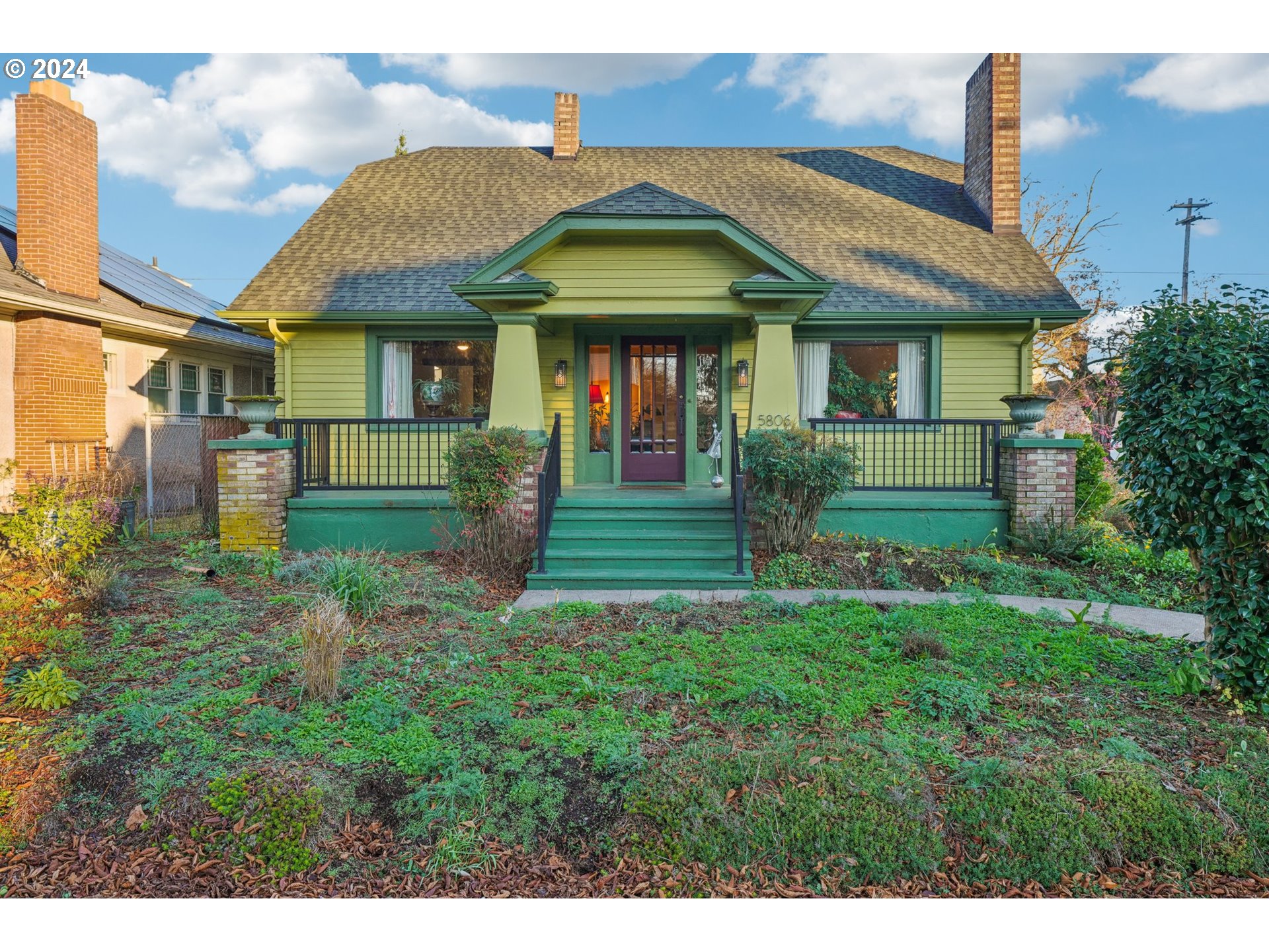 a front view of a house with garden