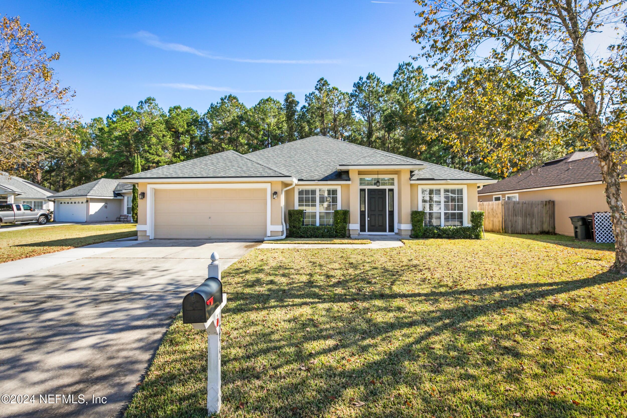 a front view of a house with a yard