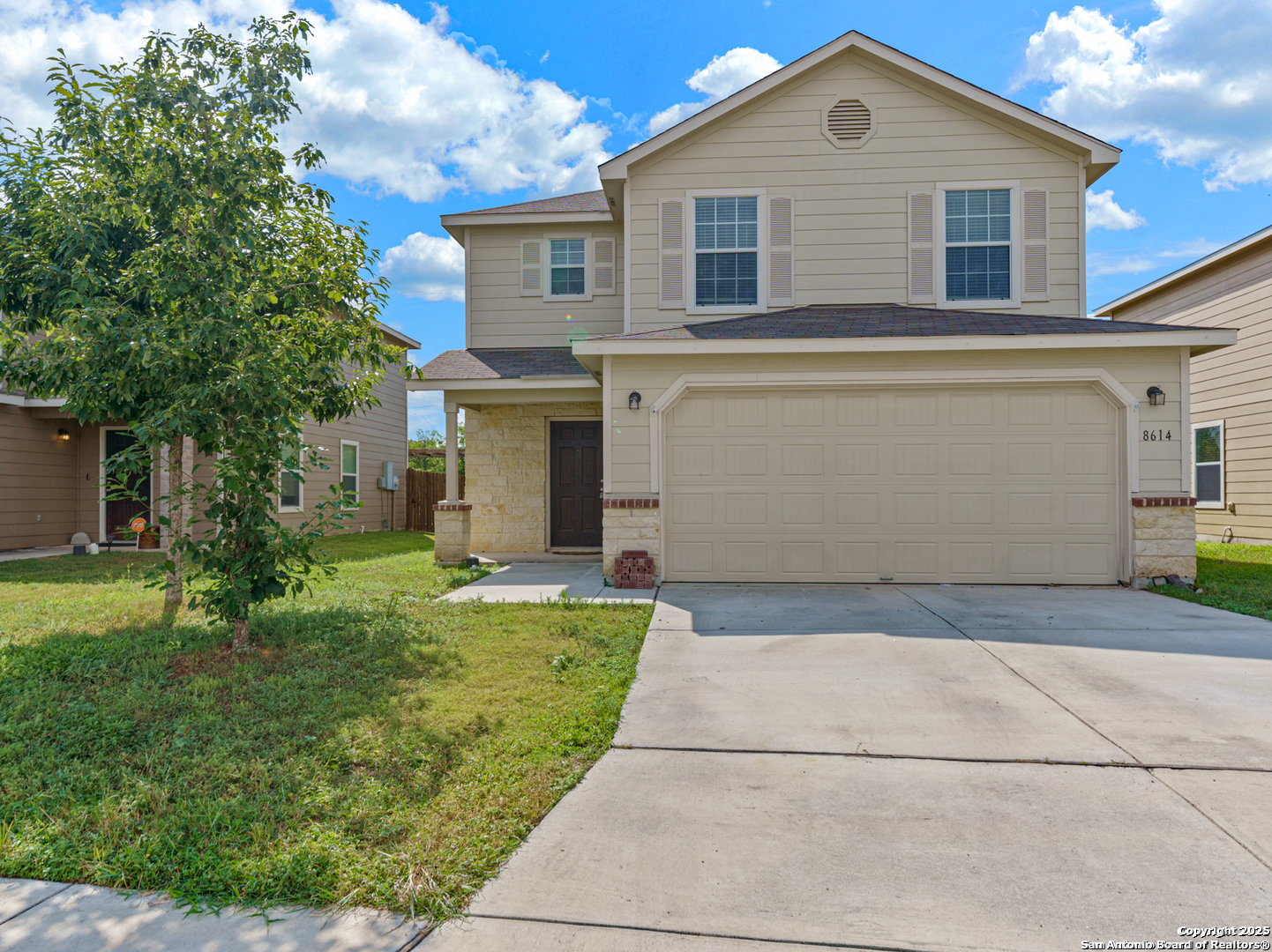 a front view of a house with a yard