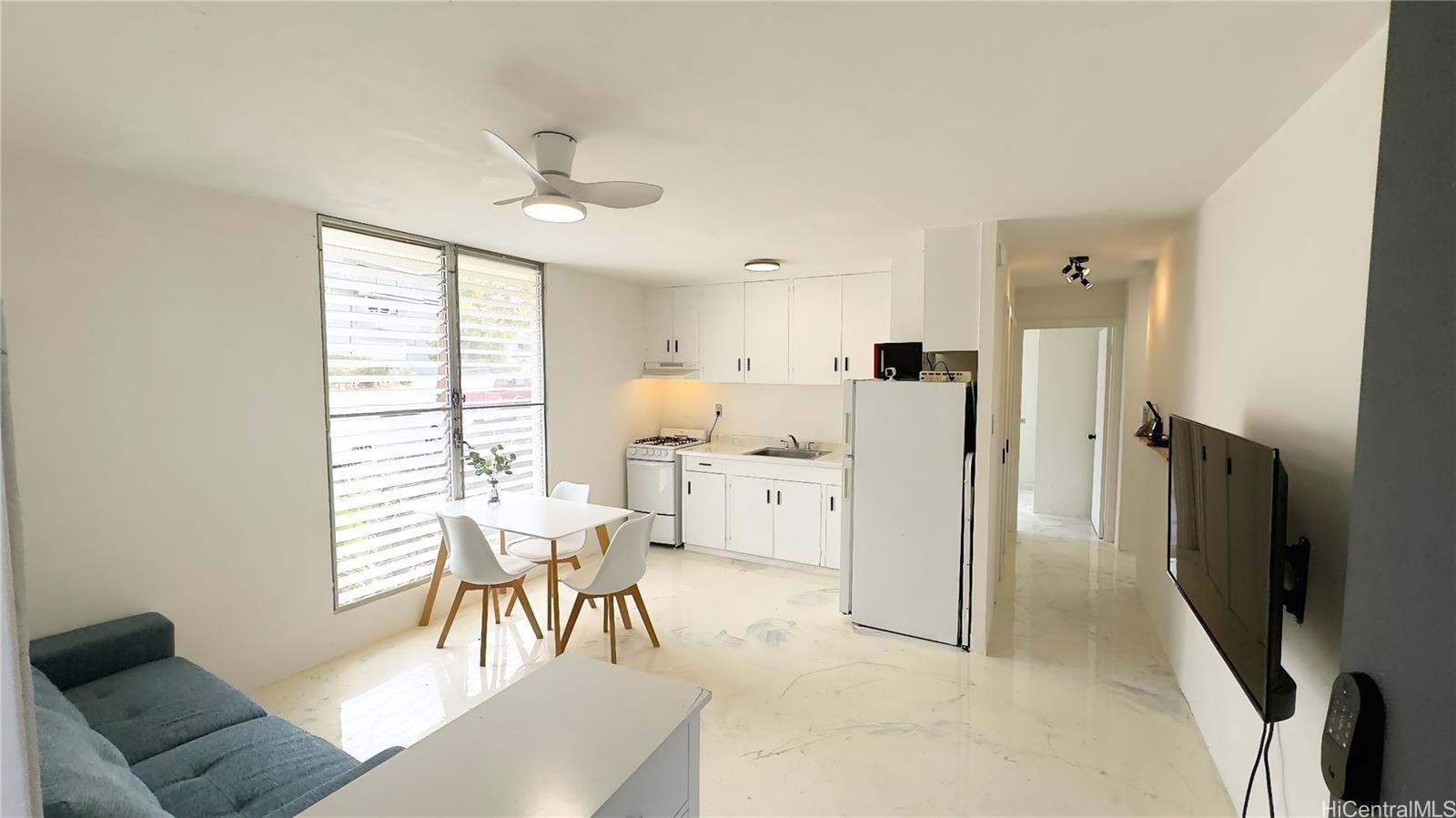 a view of a kitchen and dining room