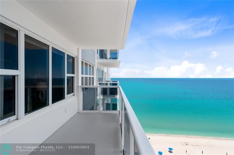 a view of balcony with floor to ceiling window and stairs