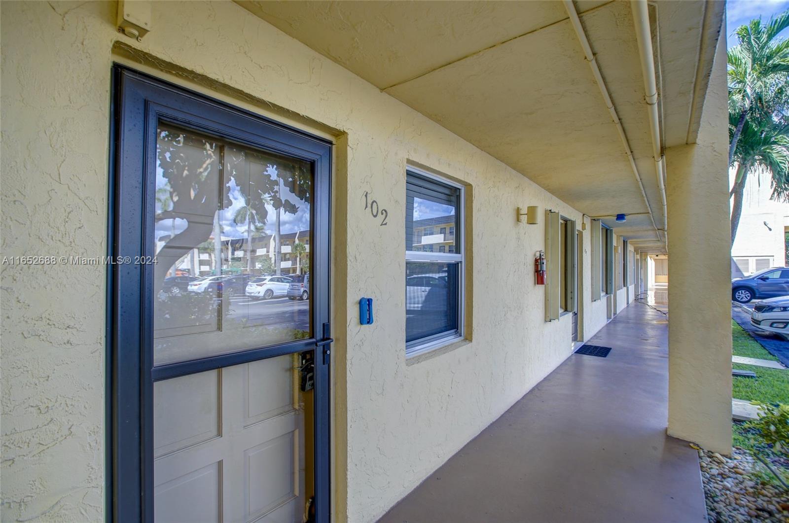 a view of a hallway with wooden shelves