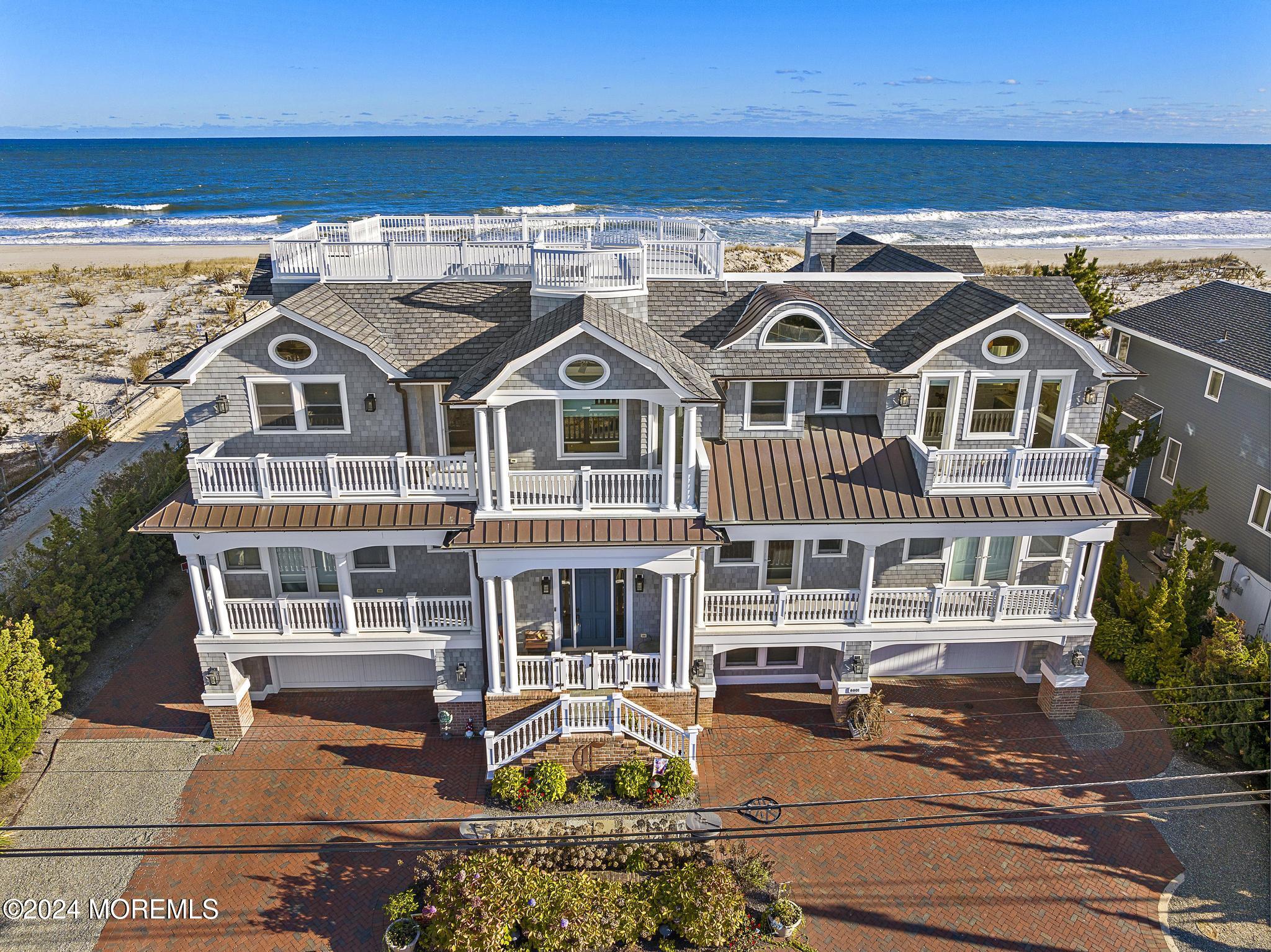 an aerial view of a house with a ocean view