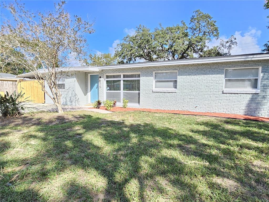 front view of a house with a big yard