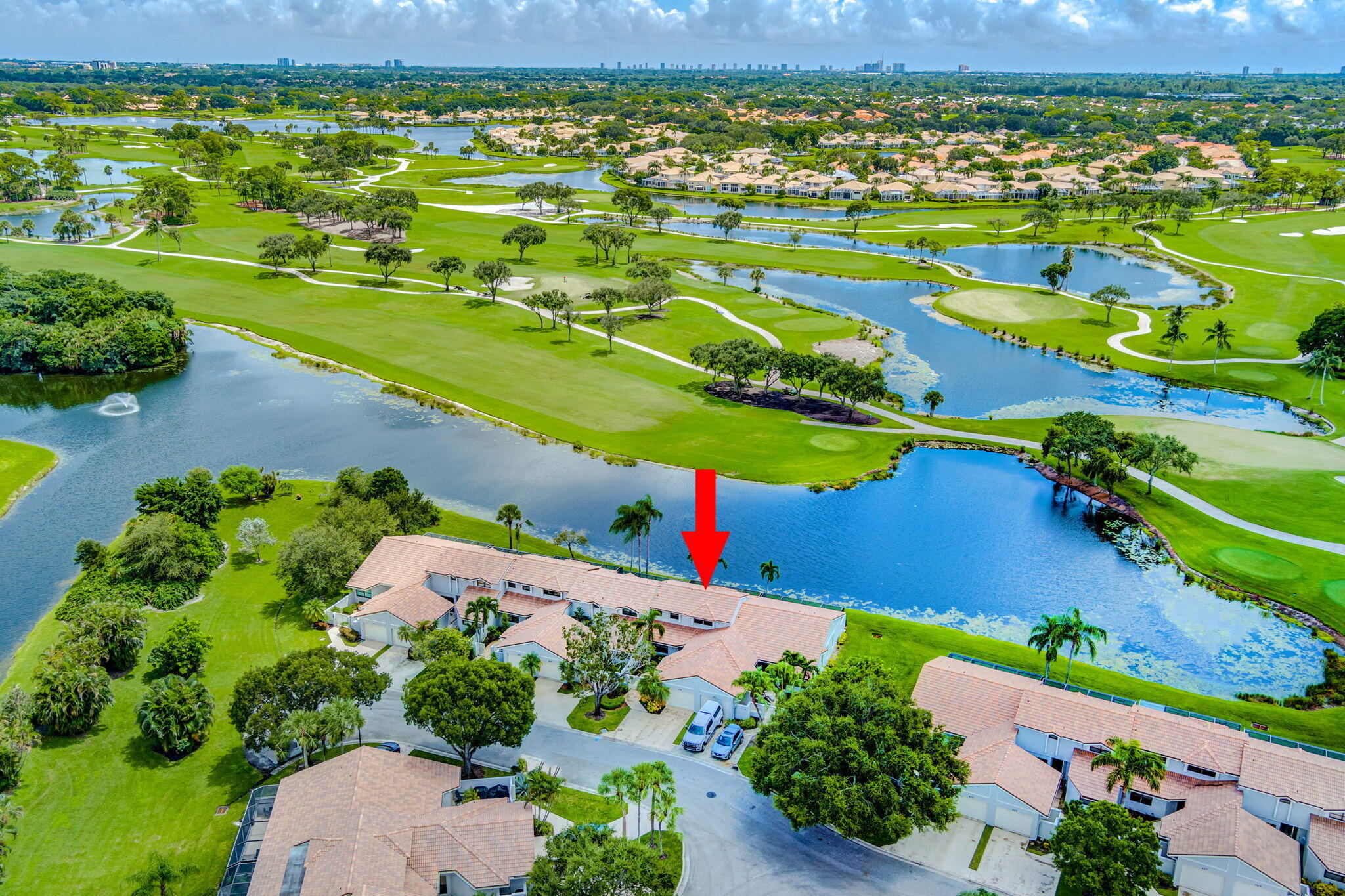 an aerial view of a houses with a yard