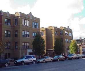 a car parked in front of a brick building