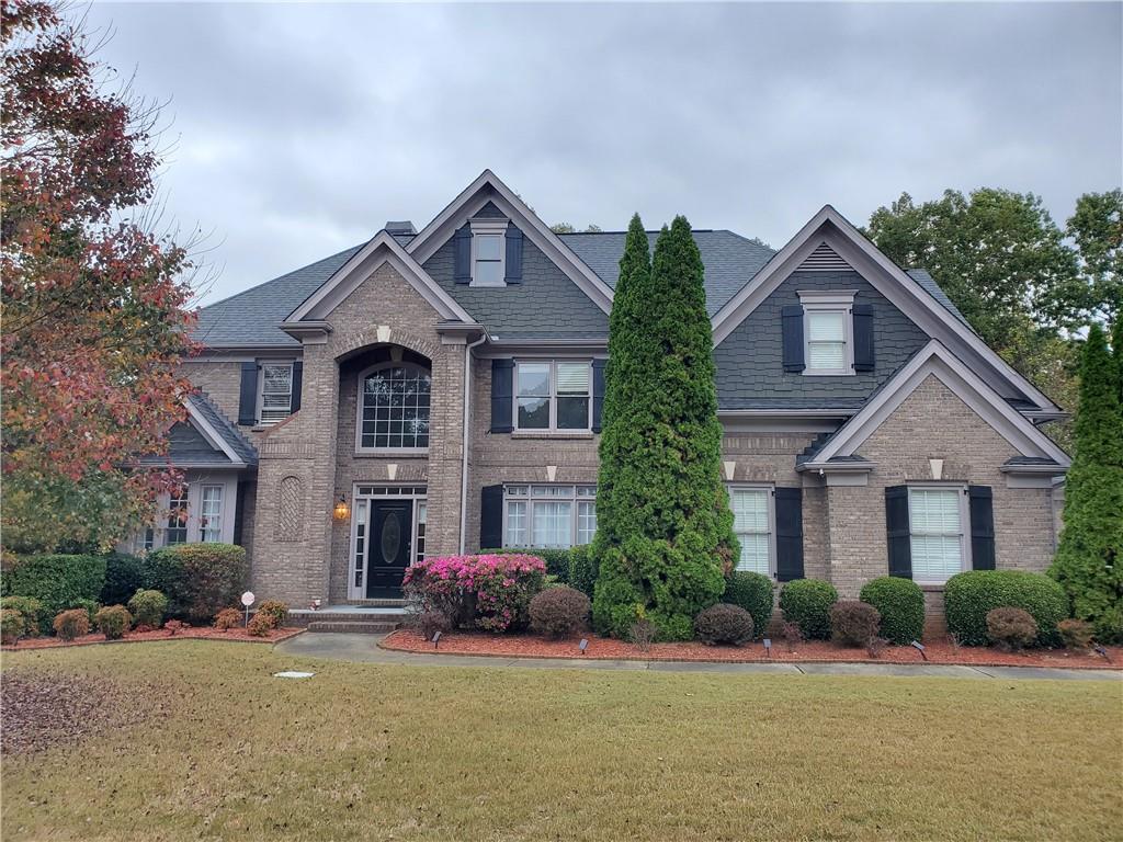 front view of a house with a small yard