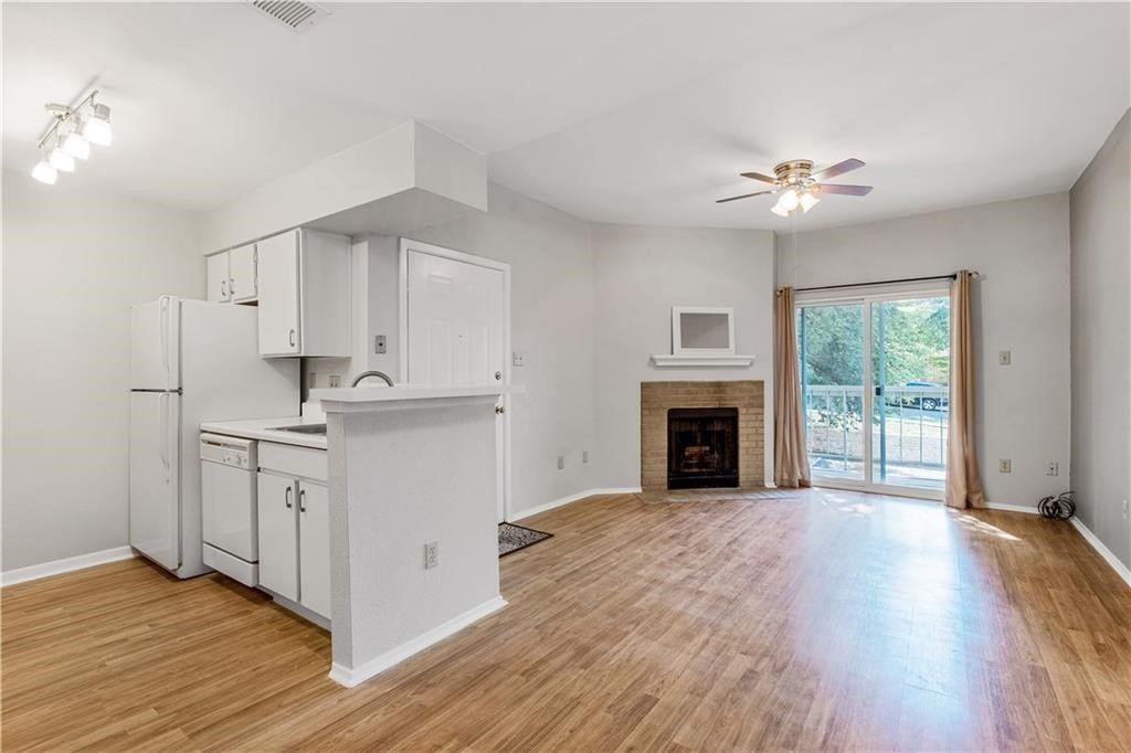 a view of a kitchen with electric appliances