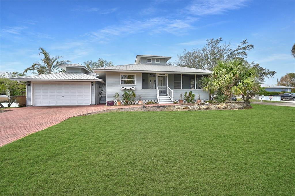 a front view of house with yard and seating area