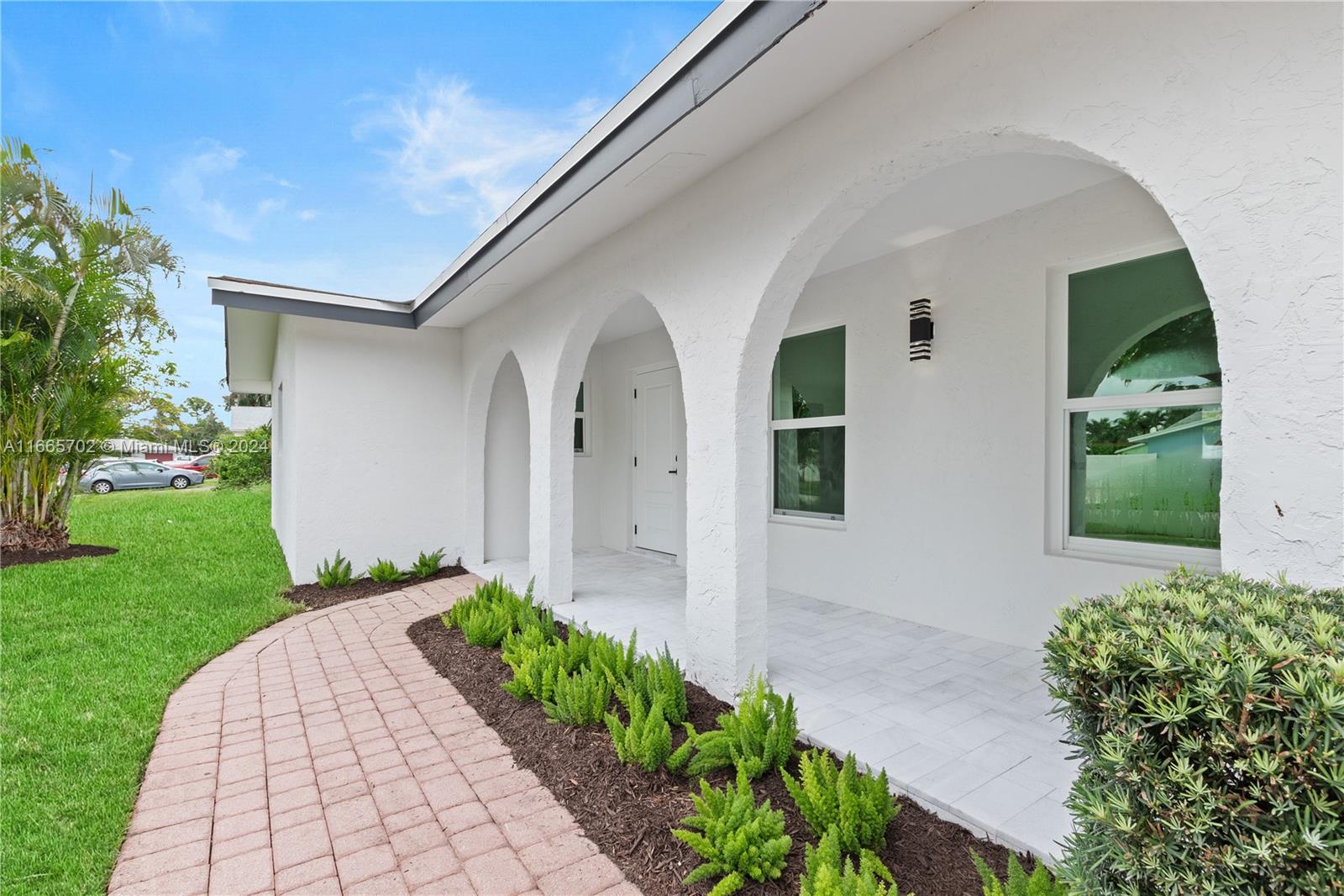 a front view of a house with a yard