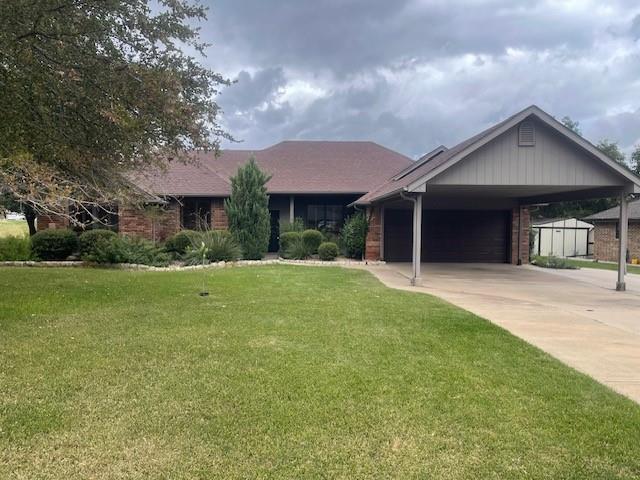 a front view of house with yard and green space