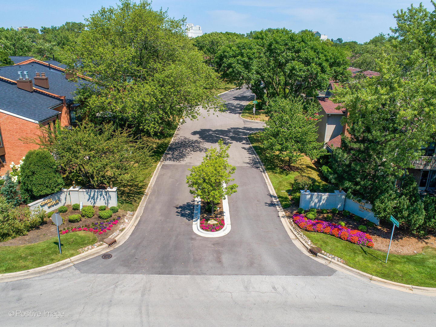 an aerial view of a house with swimming pool and garden