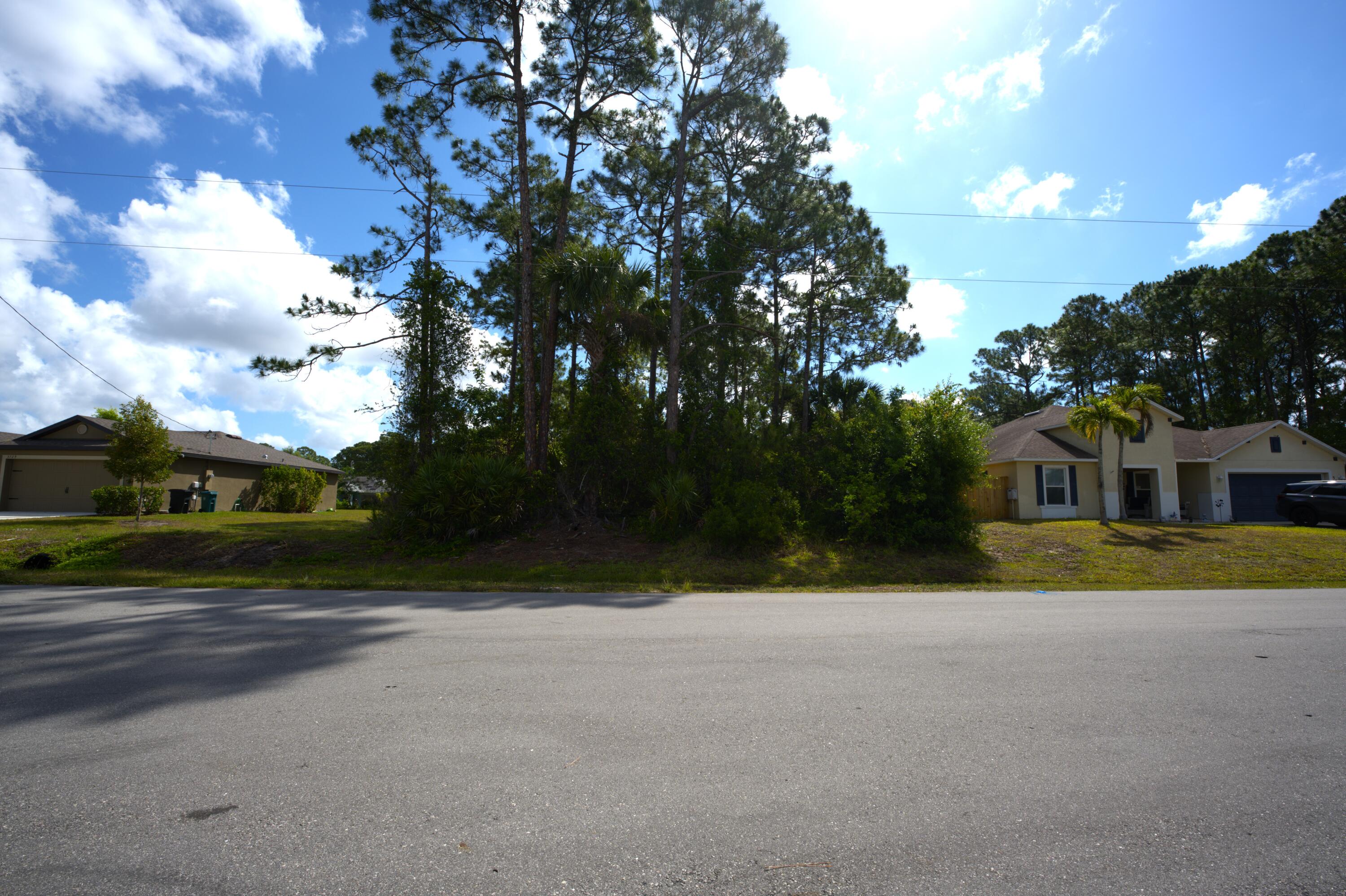 a view of the house with a yard