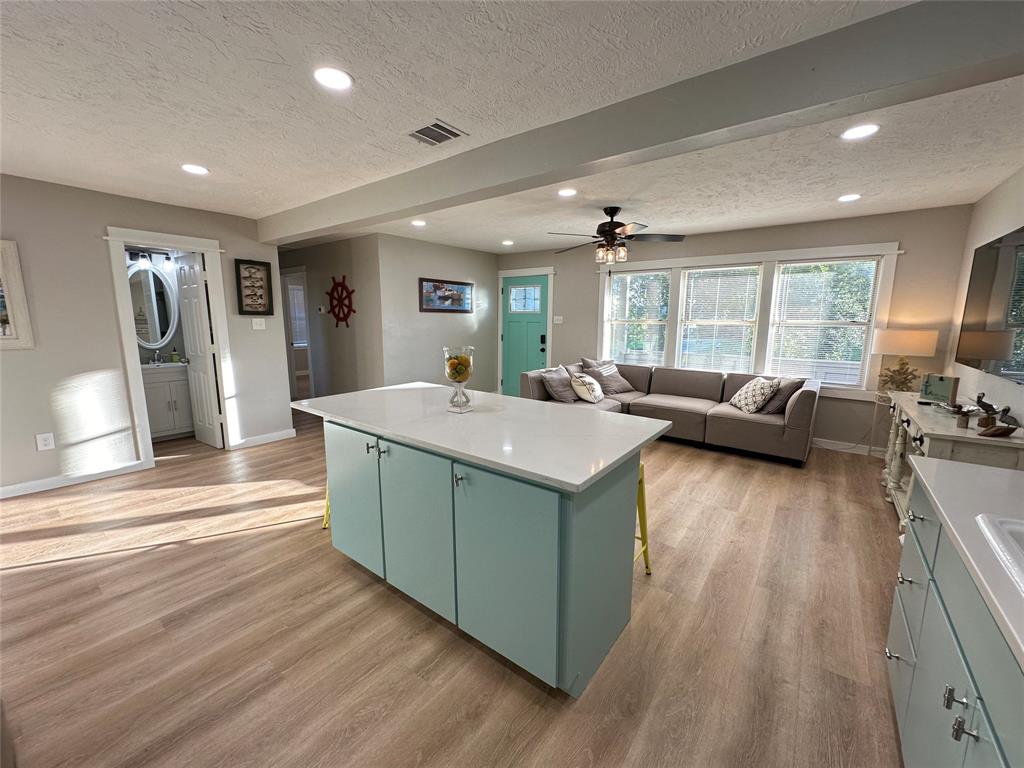 Refreshing colors with an open concept living/kitchen area creates a welcoming vibe.