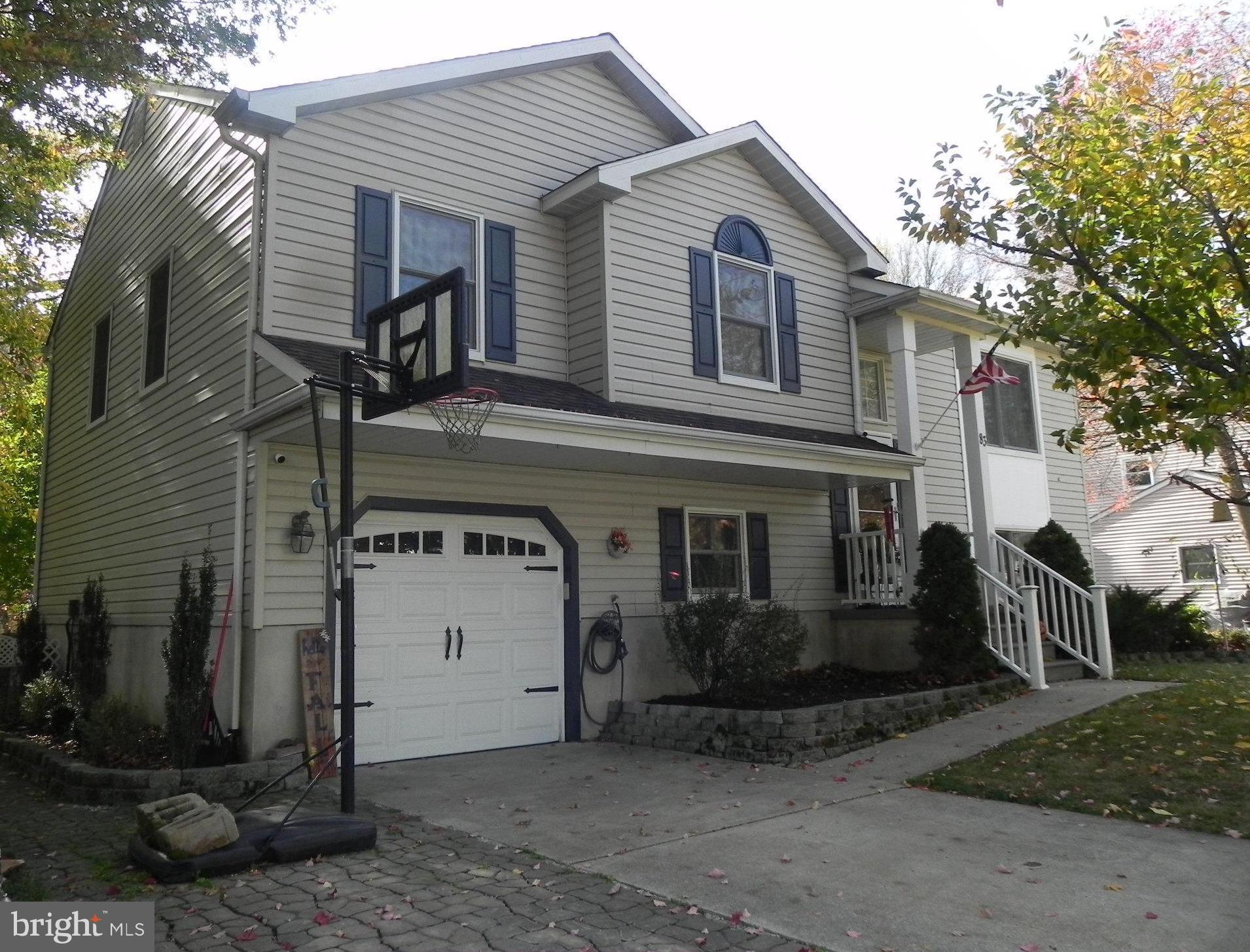 a front view of a house with a garage