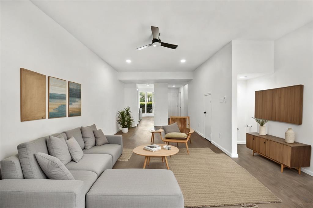 Downstairs living area virtually staged.