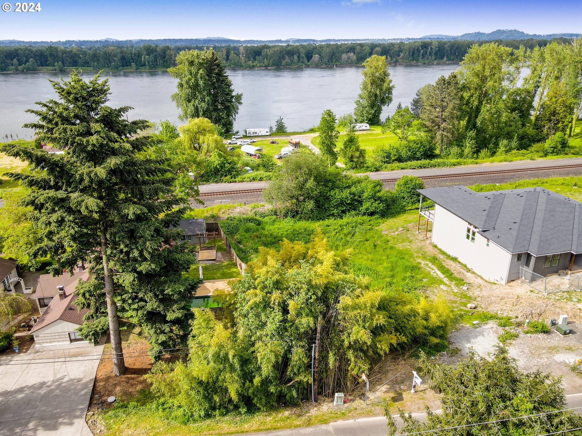 a view of a lake with a yard