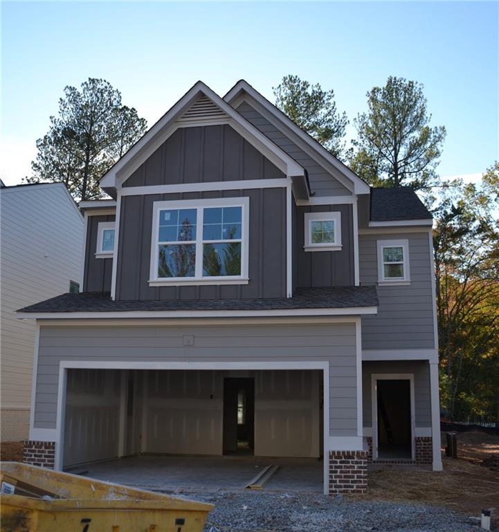 a front view of a house with garage